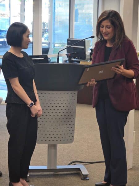 Councilmember Luz Reyes-Martín (District 1) presenting the proclamation to Kathy Bui