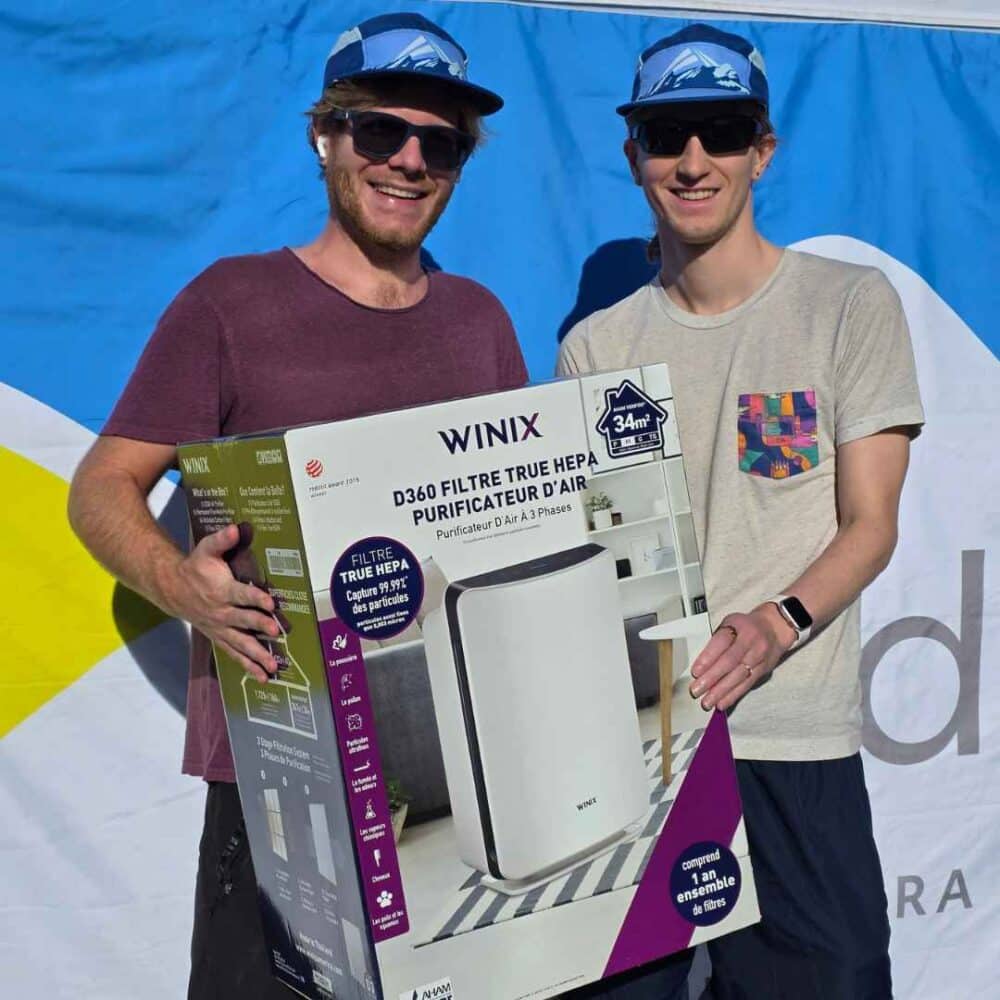 Two men with air purifier at APCD event in March 2026