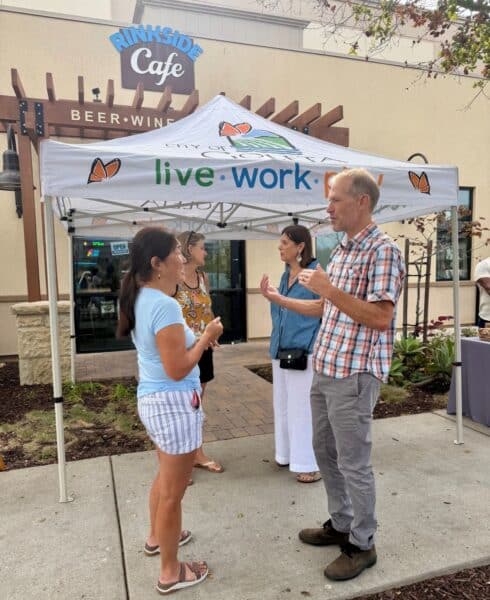 City Manager Robert Nisbet and Mayor Paula Perotte chatting with community members