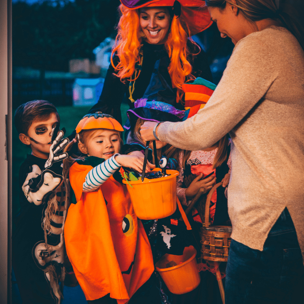 Kids Trick or Treating in costume at Halloween